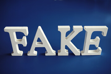 The letters spelled the word fake. The concept of modern information technology. Fake and facts in...