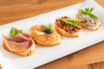 tasty canape on the wooden background