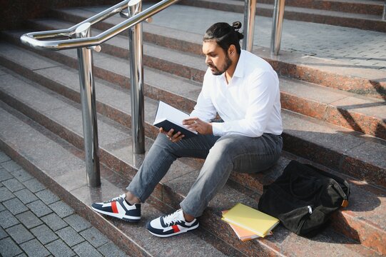 Happy Indian Male Student At The University.