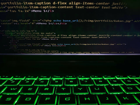 a computer program code that is often used. Computer language source code in the laptop with flashing keyboard or illuminated keyboard.