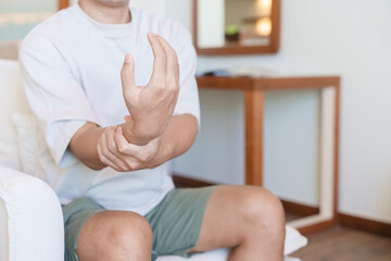 man having wrist pain because using smartphone or computer long time. De Quervain s tenosynovitis, rheumatism, arthritis, osteoarthritis, ergonomic, Carpal Tunnel Syndrome or Office syndrome