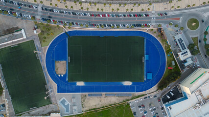 Obraz premium Aerial photography of a football stadium with an athletics track. Training ground. Speedway. Marathon.