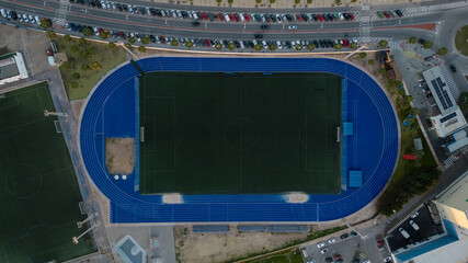 Aerial photography of a football stadium with an athletics track. Training ground. Speedway. Marathon.