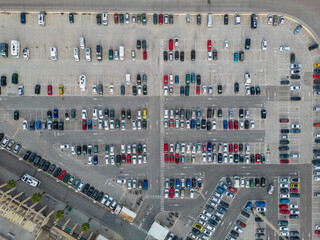 Parking. Aerial view of cars parked in line in a parking lot. Colored cars. drone view	
