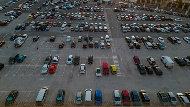 Parking. Aerial view of cars parked in line in a parking lot. Colored cars. drone view	
