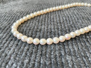 pearl necklace on black background