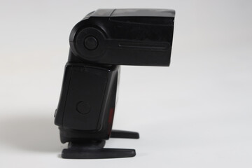 modern flash for low-light photography on a white background