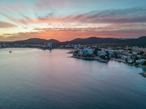 Spain, Balearic Islands, Mallorca, Santa Ponsa, Aerial view of seaside town at dusk