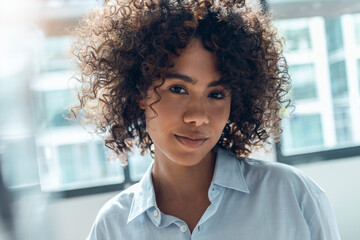 Young woman with curly hair at home