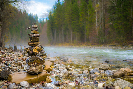 Stack of pebbles at riverbank