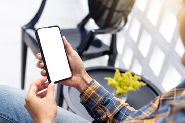 cell phone blank white screen mockup.hand holding texting using mobile on desk at office.background empty space for advertise.work people contact marketing business,technology