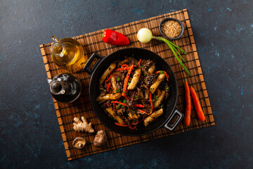 Traditional Korean Tteokbokki rice noodles with beef, vegetables and shitake mushrooms. Prepared in a wok.