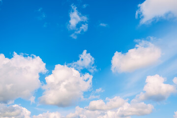 Naklejka na ściany i meble Blue sky with white cumulus clouds moving fast in day light. Cloudscape. Nature background. Windy weather forecast. Religion concept. Heaven landscape. Fresh air. Morning inspiration. Daylight