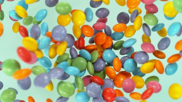 Super slow motion of flying candies up in the air. Camera in super fast motion. Filmed on high speed cinema camera, 1000 fps, placed on high speed cine bot.