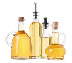Different glass bottles of cooking oil on white background