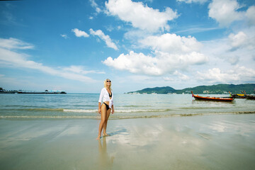 Obraz premium Portrait beautiful mature caucasian woman relax smile leisure on the beach sea ocean in travel vacation. Happy woman enjoy freedom at the beach. at sunset.