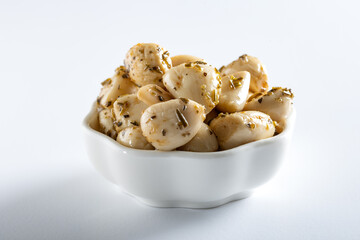 Canned garlic in a white bowl