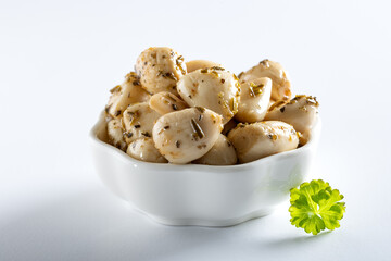 Canned garlic in a white bowl
