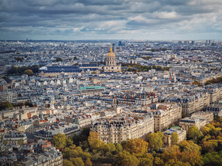 Fototapeta na wymiar Aerial view of Paris cityscape, France. Les Invalides building with golden dome. Autumn parisian scene