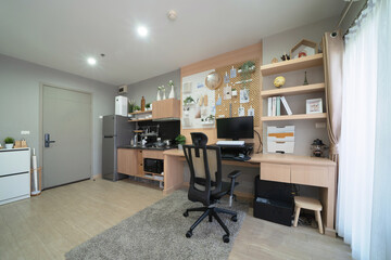 White luxury modern living room, computer desk area. Office interior and decoration at condominium or apartment, house, interior design. Lifestyle.