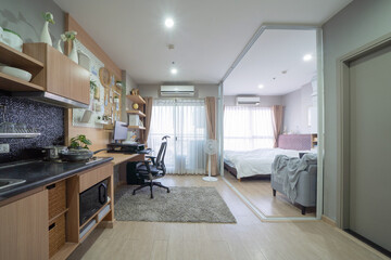 Fototapeta premium White luxury modern living room, computer desk area. Office interior and decoration at condominium or apartment, house, interior design. Lifestyle.