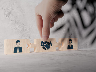 Wooden blocks with an icon of a woman and a man and mediation. Concept of mediation between spouses, divorce. Divorce proceedings before the Court. The role of the mediator...