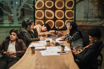 Group of business people feeling stress at the meeting