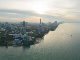 Naklejka premium Aerial view of Pattaya sea, beach in Thailand in summer season, urban city with blue sky for travel background. Chon buri skyline.