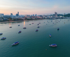 Naklejka premium Aerial view of Pattaya sea, beach in Thailand in summer season, urban city with blue sky for travel background. Chon buri skyline.