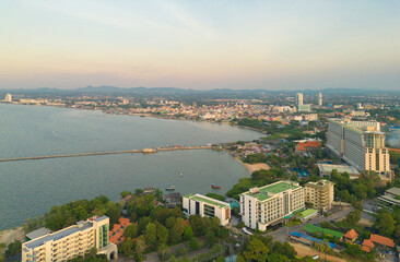 Aerial view of Pattaya sea, beach in Thailand in summer season, urban city with blue sky for travel background. Chon buri skyline.