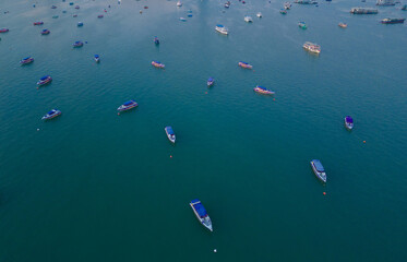 Aerial view of boats in Pattaya sea, beach with sunset sky for travel background. Chonburi, Thailand.