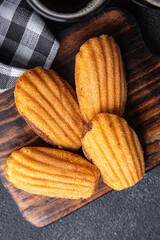 Madeleine biscuit cookies sweet French dessert meal food snack on the table copy space food background top view