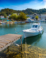 Naklejka na ściany i meble Small boat in the harbor in Greece