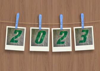  plastic clothespins and instant frame with 2023 text for pictures