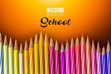 Concept of School holiday  with inscription, color pencils on black background with flare. .