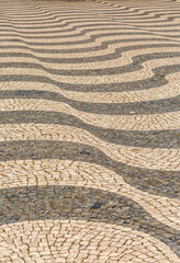 The traditional black and white paved tiles on the floors in many areas of Lisbon, Portugal