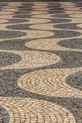 The traditional black and white paved tiles on the floors in many areas of Lisbon, Portugal