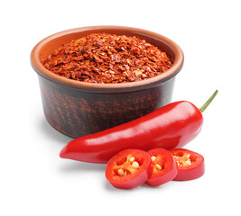 Bowl of chipotle chili flakes and fresh jalapeno pepper on white background