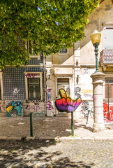 Brightly colored graffiti on building exteriors in Lisbon, Portugal
