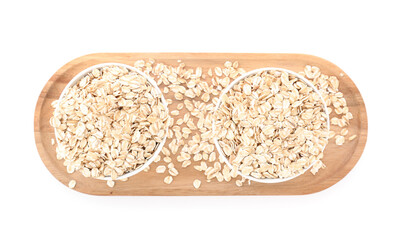 Wooden board with bowls of raw oatmeal on white background