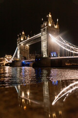 Fototapeta na wymiar London Bridge or tower Bridge at night with the lights on and the River Thames below.
