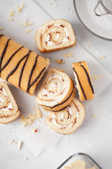 Delicious sponge cake roll on white table