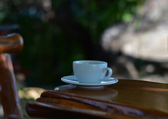 Black coffee is hot coffee in a white cup.