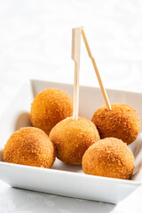 Homemade fried Arancini on the white