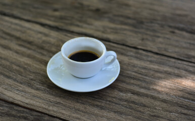 Black coffee is hot coffee in a white cup.