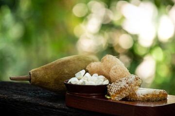 Face mask with baobab and honey on nature background.