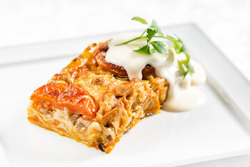 portion of lasagna with sauce