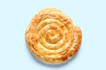 Delicious cheese pie on blue background
