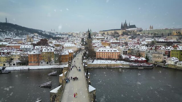 Aerial winter view of the city of Prague, Czech Republic, with snow falling