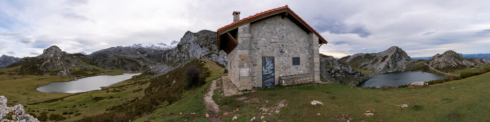 Panoramic view of the refuge and the Covadonga Lakes from the entrelagos viewpoint. Picos de Europa National Park. Asturias, Spain